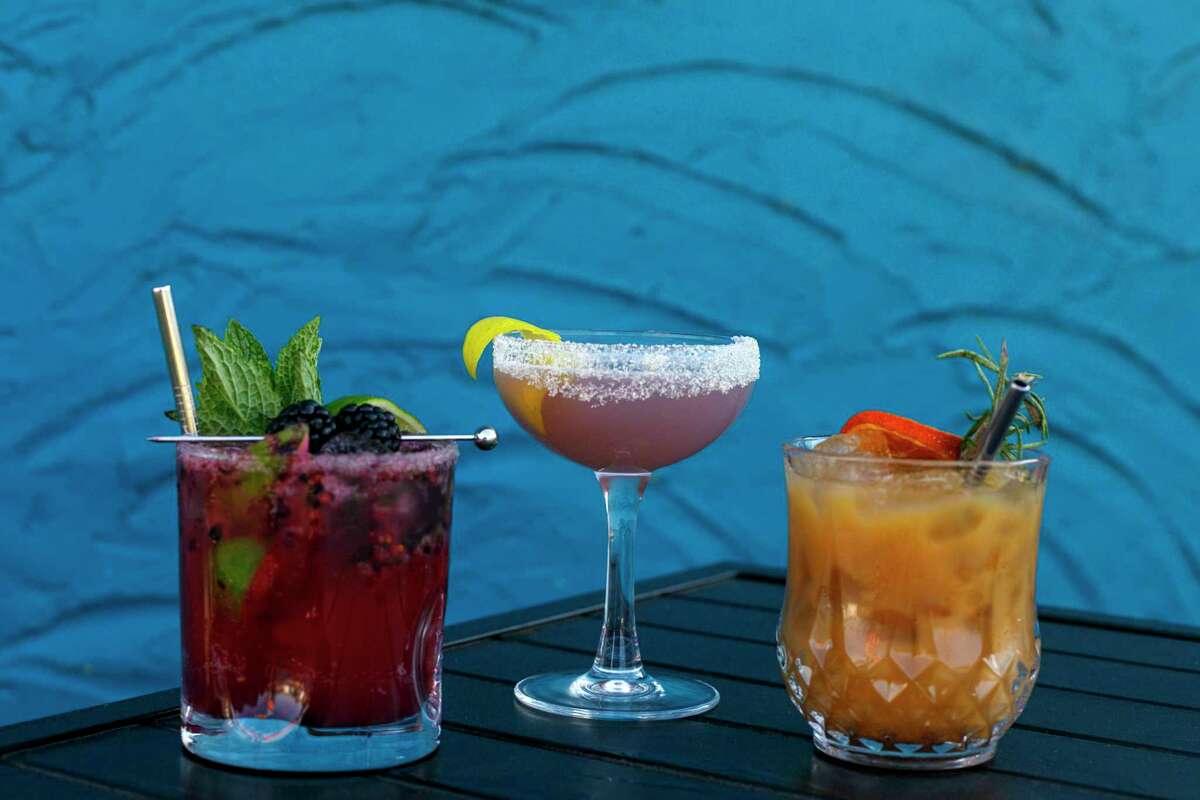 Three hand-crafted non-alcoholic cocktails named Blackberry Nojito, from left, Enchanted and Pumpkin King are three of a long list of drinks offered at HASH Vegan Eats in San Antonio, Texas. Bar manager and head mixologist Jaselin Holstein designed the non-alcoholic drink menu for the vegan restaurant.
