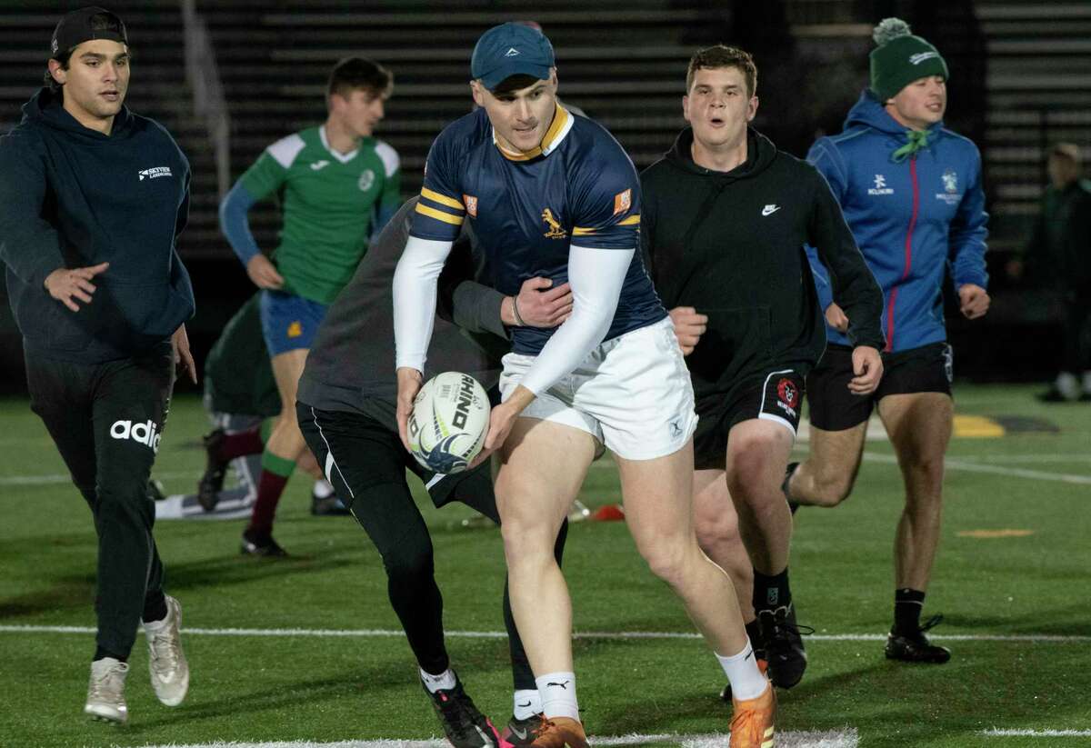Andrew McCallum passes the ball as the Siena men's rugby team holds practice in preparation to compete in Friday's semifinal in the Men's Collegiate Rugby Championship in Houston. The Saints won their semifinal over College of Charleston, 64-0.
