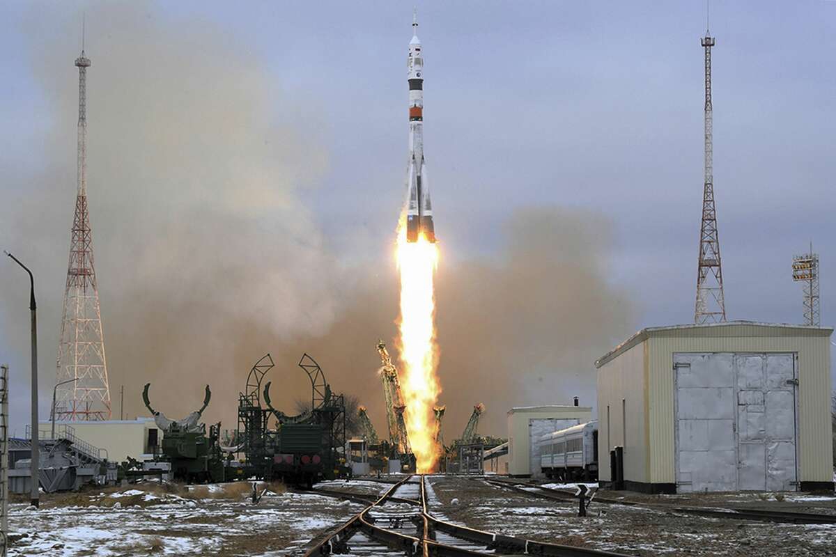 In this photo released by the Roscosmos, the Soyuz-2.1a rocket booster with Soyuz MS-20 space ship carrying Russian cosmonaut Alexander Misurkin, spaceflight participants Yusaku Maezawa and Yozo Hirano of Japan to the International Space Station, ISS, blasts off at the Russian leased Baikonur cosmodrome, Kazakhstan, Wednesday, Dec. 8, 2021. (Roscosmos Space Agency via AP)