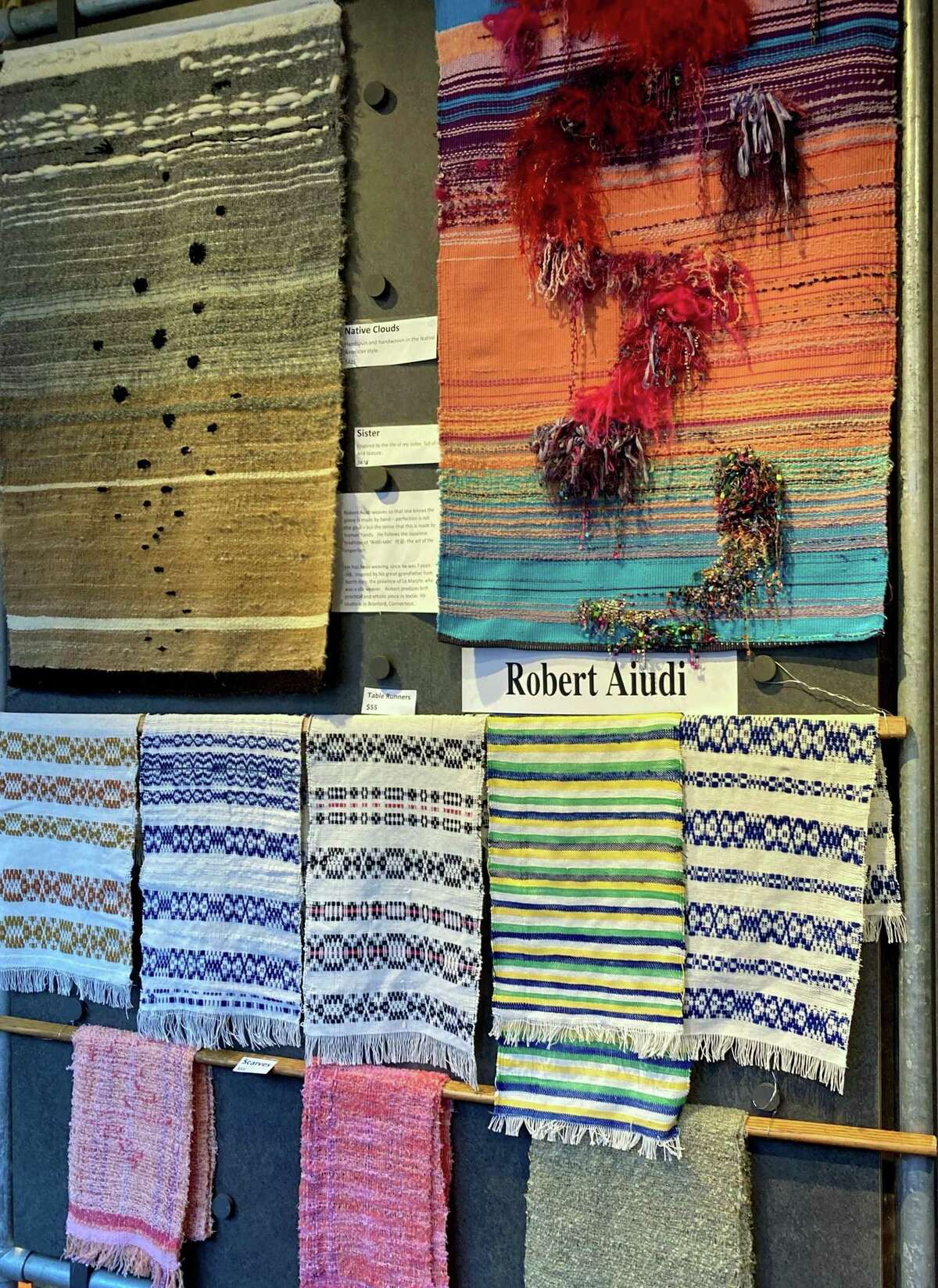 Weaver Robert Aiudi will be featured at the Market. Above, his work hands in the gallery now.