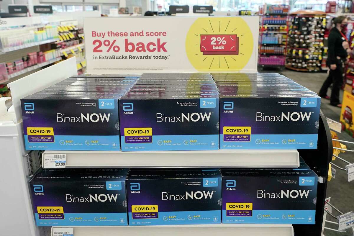 Boxes of BinaxNow home COVID-19 tests made by Abbott are shown for sale Monday, Nov. 15, 2021, at a CVS store in Lakewood, Wash., south of Seattle. After weeks of shortages, retailers like CVS say they now have ample supplies of rapid COVID-19 test kits, but experts are bracing to see whether it will be enough as Americans gather for Thanksgiving and new outbreaks spark across the Northern and Western states. (AP Photo/Ted S. Warren)