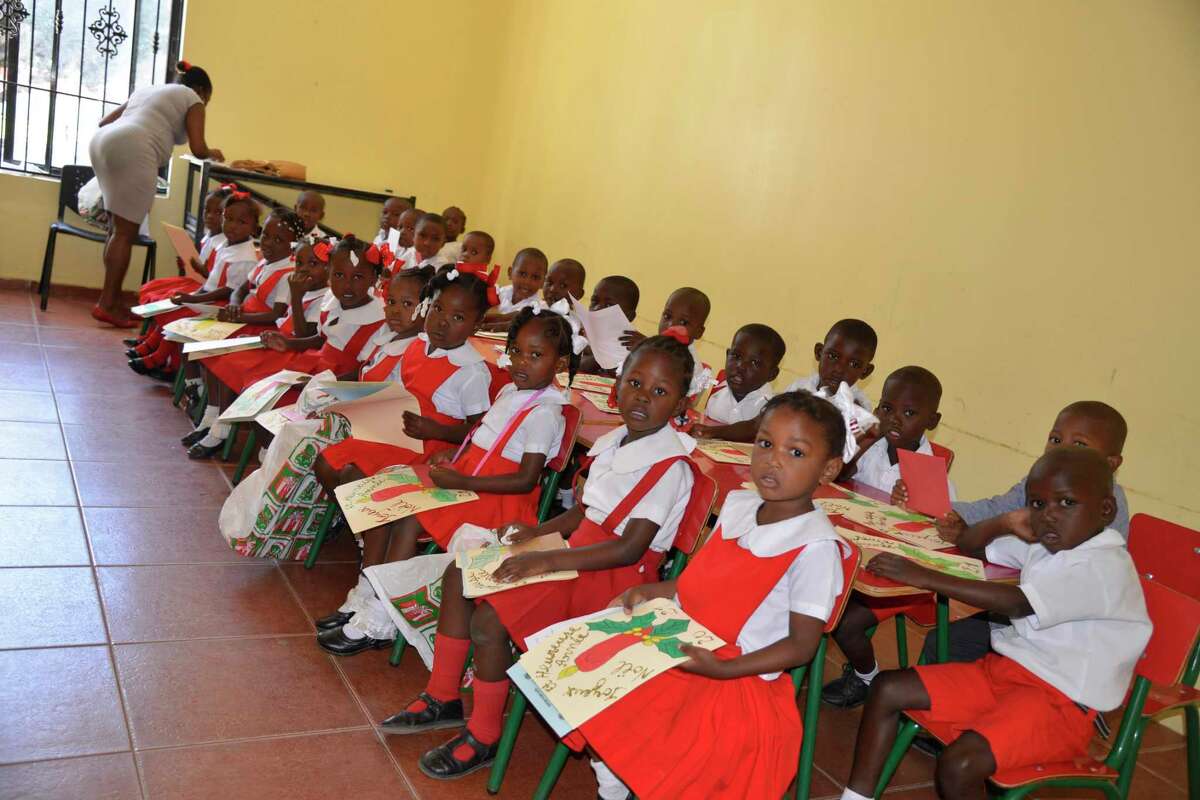 Students at Danita’s Children, a local school in Haiti that educates children in grades K-13, enjoy gifts sent to them from Riverside School in Greenwich.