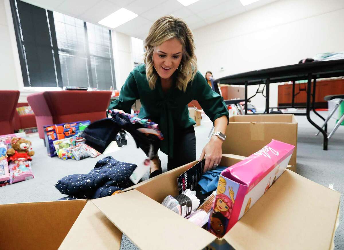Kinda Schiffner, director of the Wildkat Resource Center, sorts through Toys and other gifts as part of the center’s Christmas Toys drive which will provide 450 families with gifts. Schiffner will step down next week after a year leading Willis ISD’s outreach center, which offers free items for WISD employees, students, and their families in need of assistance.