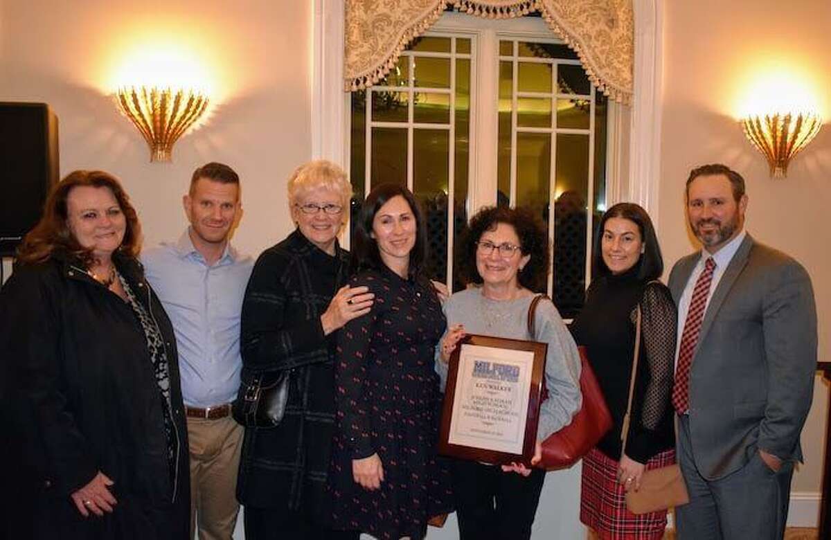 Ken Walker was inducted into the Milford Sports Hall of Fame. Sister Patti Walker, son-in-law Mike Mullins, sister JoAnn Walker, daughter Whitney Mullins, wife Nancy Walker, daughter-in-law Lynn Walker and son Garrett Walker were on hand to accept the plaque.