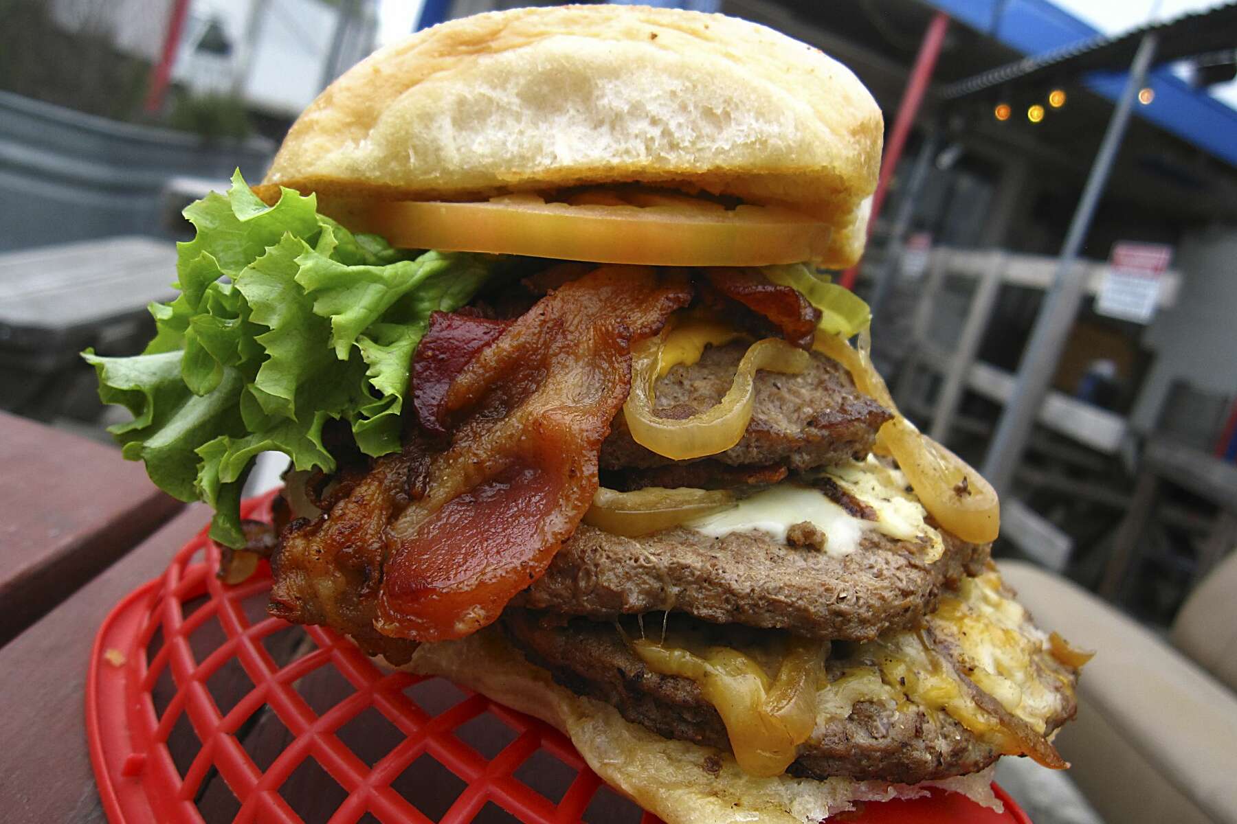 A Texas chain is demanding San Antonio's Papa's Burgers change its