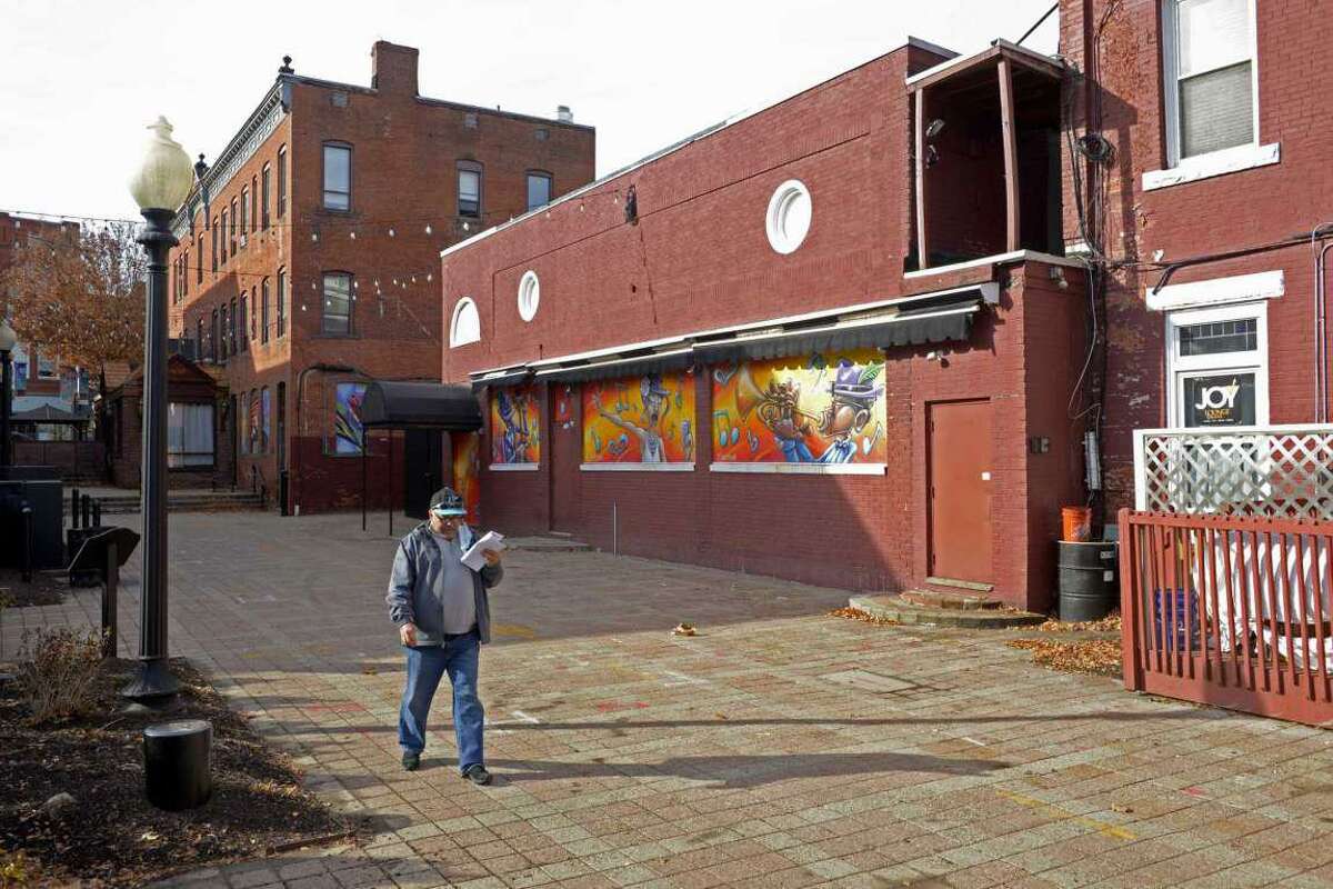 Tuxedo Junction, with the mural windows, would be sold to the Savings Bank of Danbury and razed as part of a larger downtown office development, under a deal being proposed by City Hall.