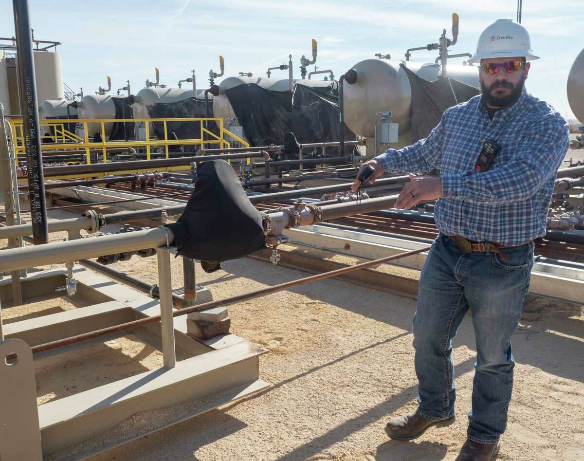 An Ovintiv site supervisor talks about some of the winterization techniques they utilize, like a thermal covering on control mechanisms and pressure valves, 12/08/2021 at a tank battery facility. Tim Fischer/Reporter-Telegram