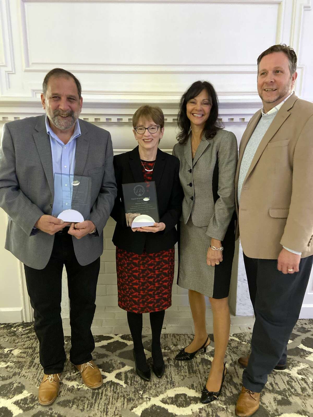 Winners of the 2021 Greater Capital Association of Realtors Good Neighbor Awards Miguel Berger of Howard Hanna, left and Donna Hunter, Thomas J. Real Estate. GCAR CEO Laura Burns is second from right and board president Jeffrey Decatur is at right. 
