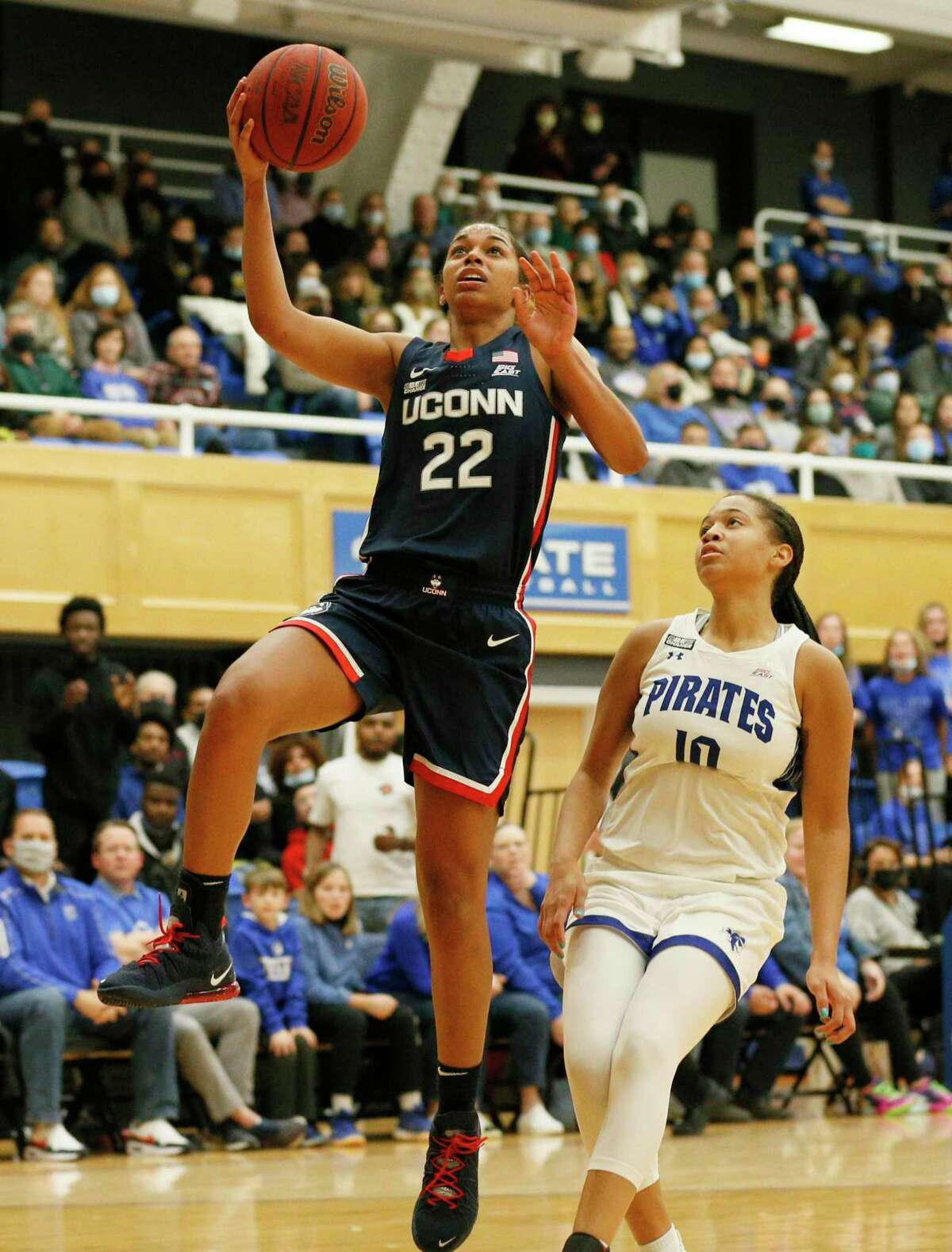 UConn guard Evina Westbrook (22) drives to the basket against Seton Hall forward Mya Bembry (10) during the second half of an NCAA college basketball game on Friday, Dec. 3, 2021, in South Orange, N.J.