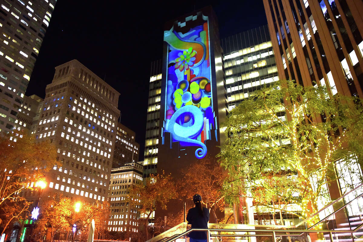 Light projections adorn One Bush Plaza as part of the Let's Glow SF art installation, on Tuesday, Dec. 7. 