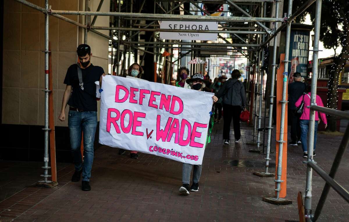 Demonstrators protest at the Powell and Market Street cable car turnaround in San Francisco on Dec. 1, 2021, as the U.S. Supreme Court reviews a Mississippi abortion law that could undermine the 1973 landmark Roe vs. Wade decision.