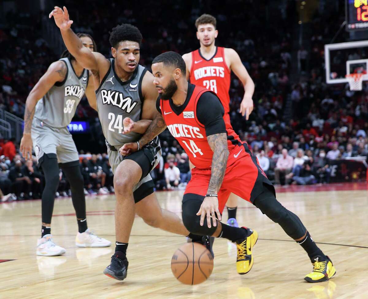 Veteran Rockets guard D.J. Augustin (14) and teammate Garrison Mathews did not accompany the team to Charlotte for Monday's game after entering the NBA's health and safety protocols.