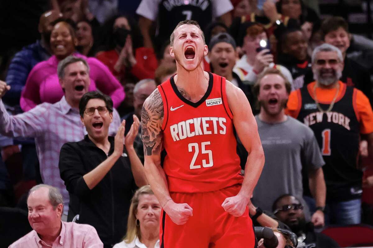 HOUSTON, TEXAS - DECEMBER 08: Garrison Mathews #25 of the Houston Rockets celebrates following a dunk during the second half against the Brooklyn Nets at Toyota Center on December 08, 2021 in Houston, Texas. NOTE TO USER: User expressly acknowledges and agrees that, by downloading and or using this photograph, User is consenting to the terms and conditions of the Getty Images License Agreement.