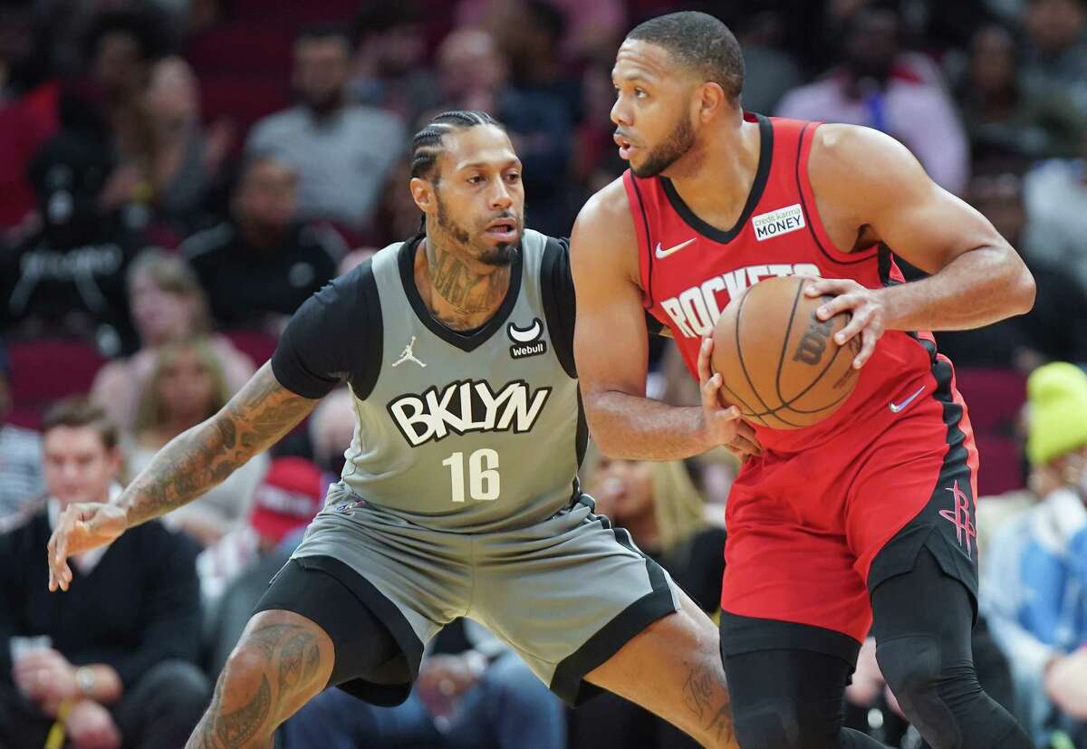 Houston Rockets guard Eric Gordon (10) drives past Brooklyn Nets forward James Johnson (16) at the Toyota Center in Houston on Wednesday, Dec. 8, 2021. Rockets beat the Nets 114-104 to continue their winning streak to seven.
