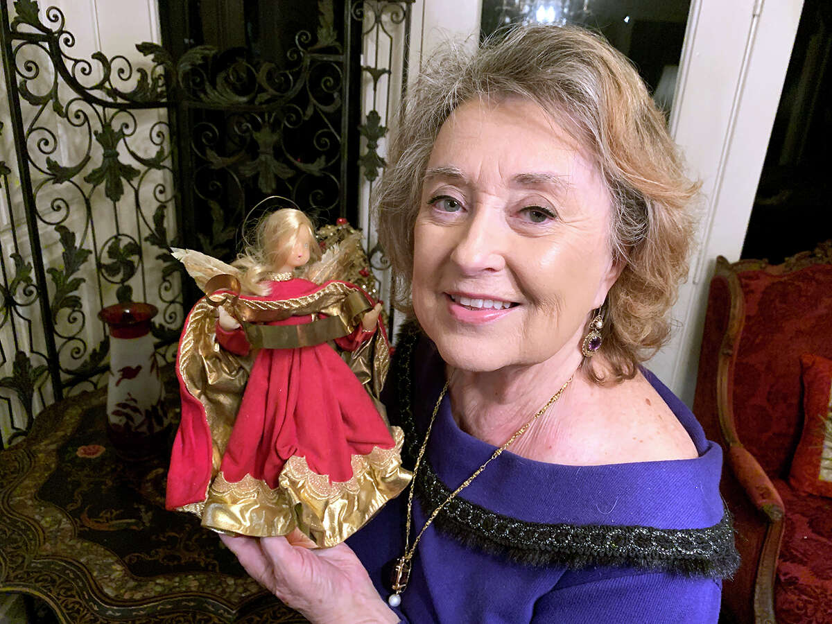 Judith Cobbett shows off a vintage wax angel from the 1950s. Her home will be part of the Oaks Historic District Neighborhood Association's Homes for the Holidays open house, Dec. 12. Photo by Andy Coughlan