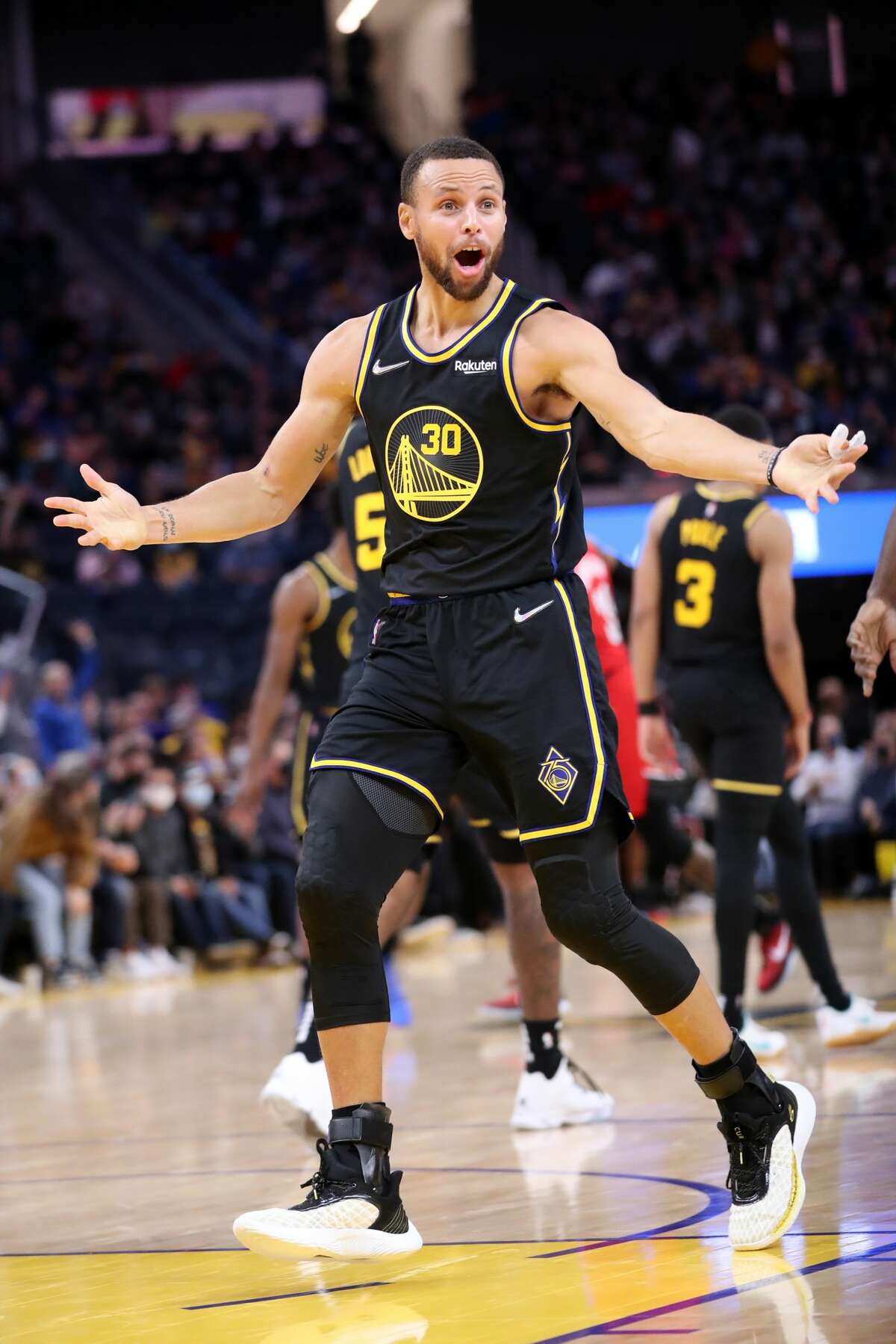 Golden State Warriors' Stephen Curry reacts to the lack off a foul call after hitting a 3-pointer in 3rd quarter against Portland Trail Blazers during NBA game at Chase Center in San Francisco, Calif., on Wednesday, December 8, 2021.