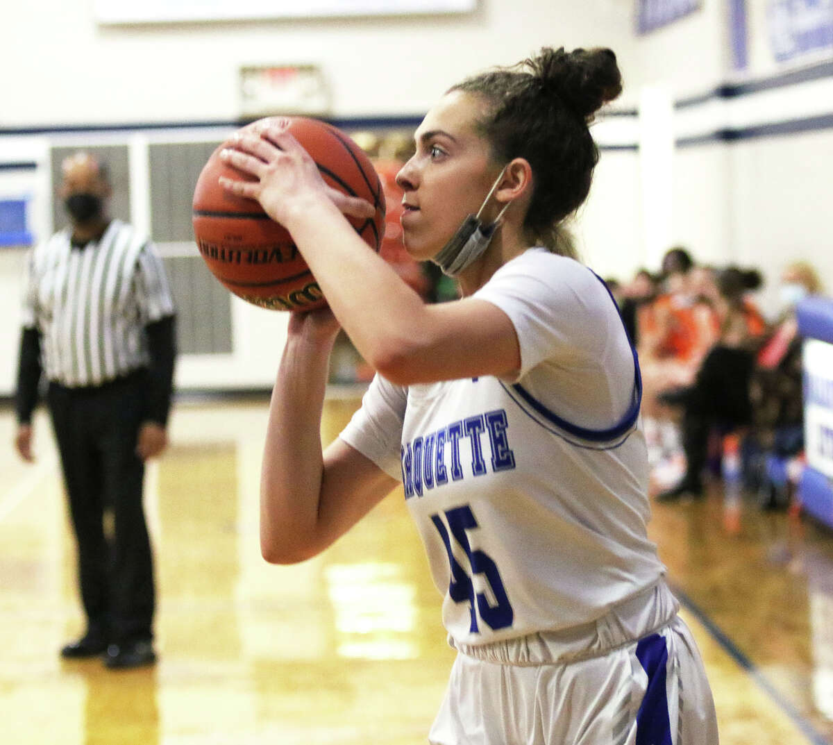 Marquette Catholic's Chloe White eyes a baseline 3-pointer during Saturday's game against Decatur St. Teresa in Alton.