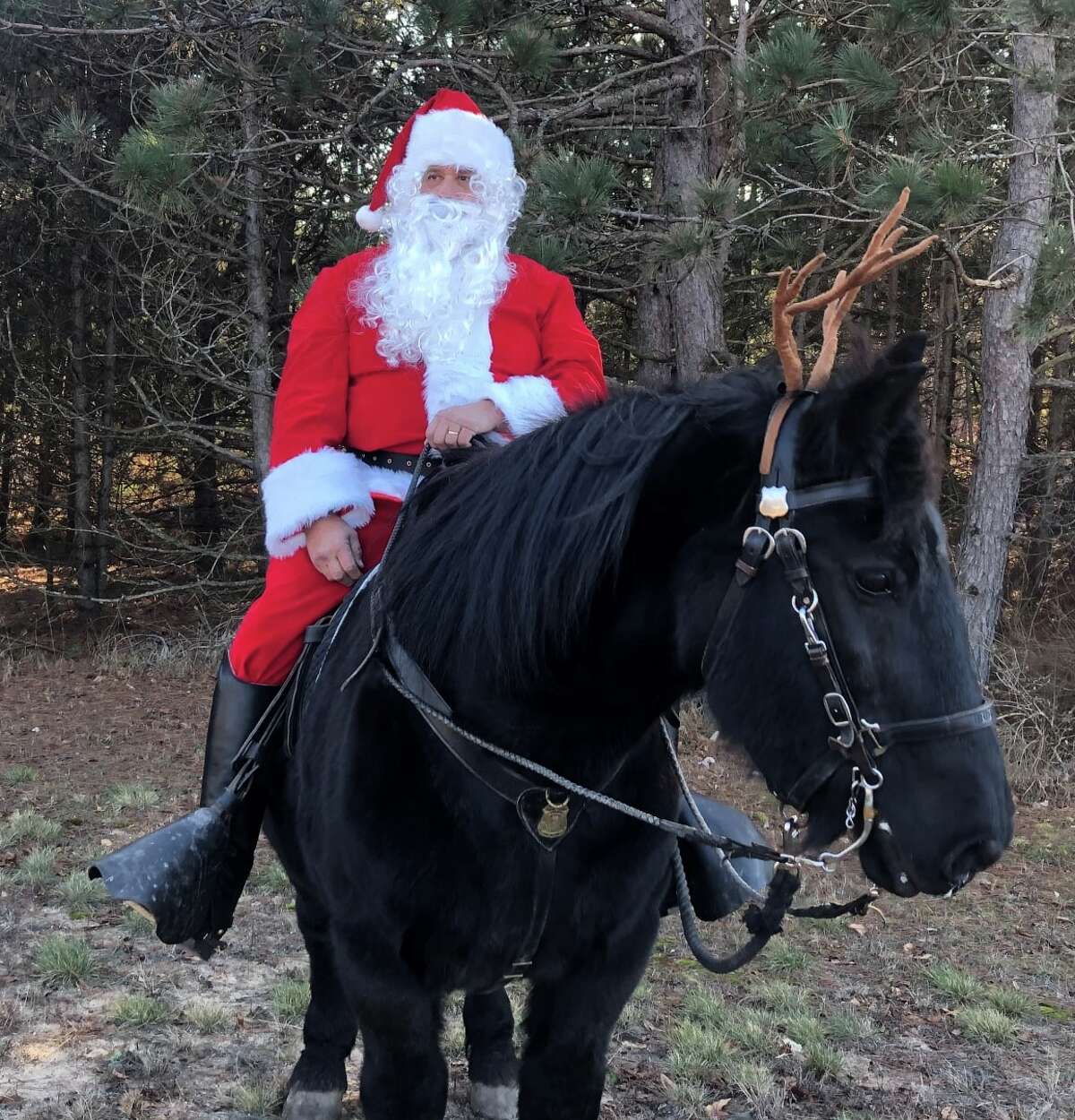 Santa and his "reindeer" Boomer will be on hand for photos at the annual Season of Giving Gift Drive to benefit Eagle Village from 9 a.m. to noon, Saturday, Dec. 11, at the Big Rapids Department of Public Safety.