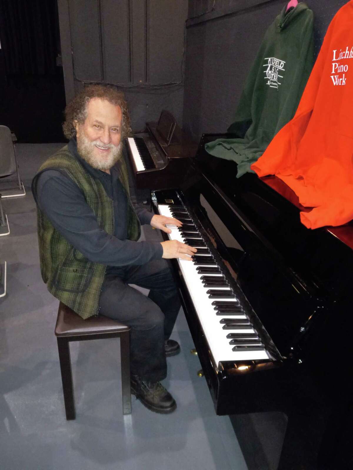 Joe DiBlasi, right, owner of the Litchfield Music Center and the Litchfield Music School, has donated two instruments to the Bantam Cinema and Arts Center, including an upright Samick piano.