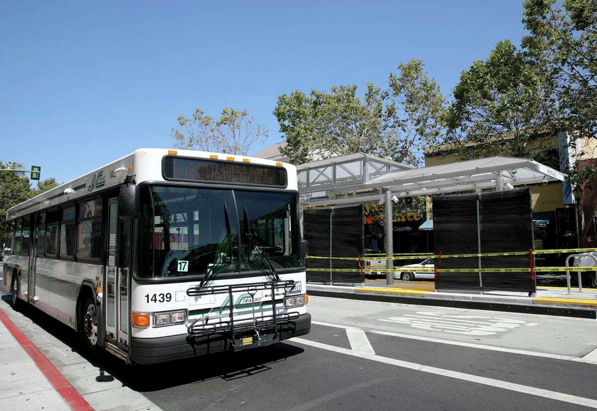 An AC Transit bus passes a Tempo BRT platform at 34th Avenue and International Boulevard in Oakland’s Fruitvale neighborhood. The transit service is requiring all of its employees to be vaccinated.