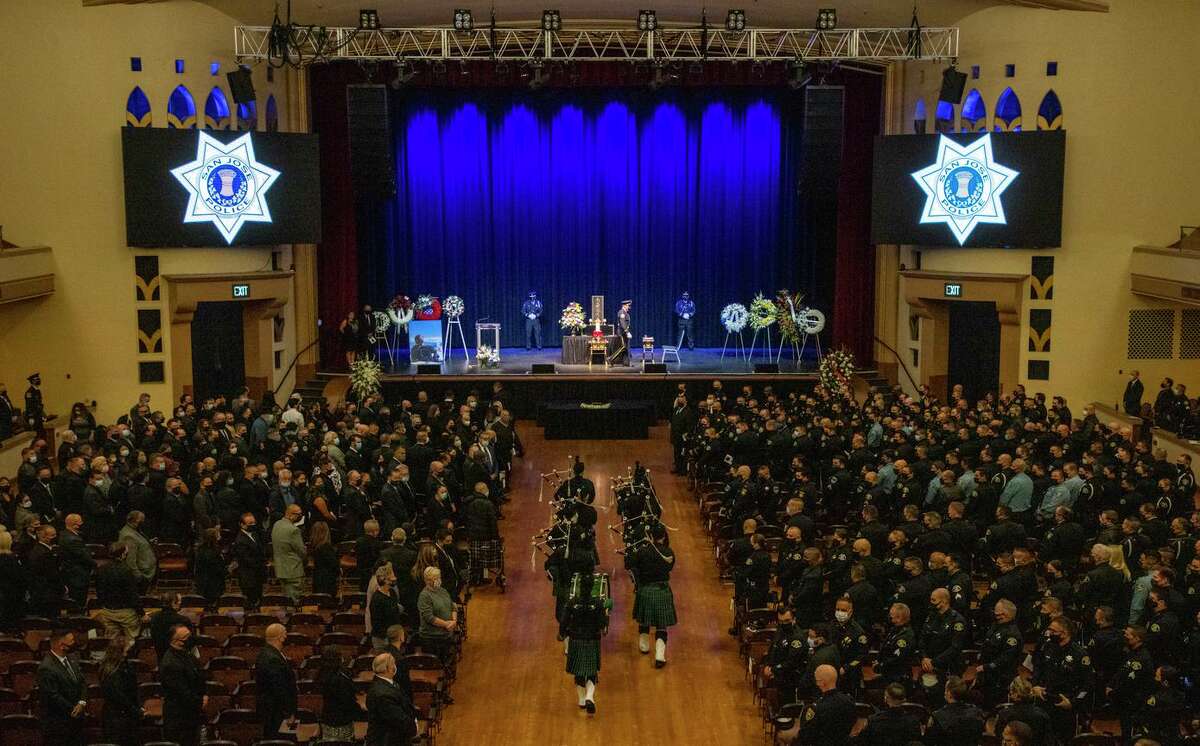 San Jose Emerald Society enters the auditorium at the start of a memorial service for Kevin Nishita at San Jose Civic Auditorium on Dec. 9. Nishita, a private guard, was killed while protecting a Bay Area news crew during an attempted armed robbery.