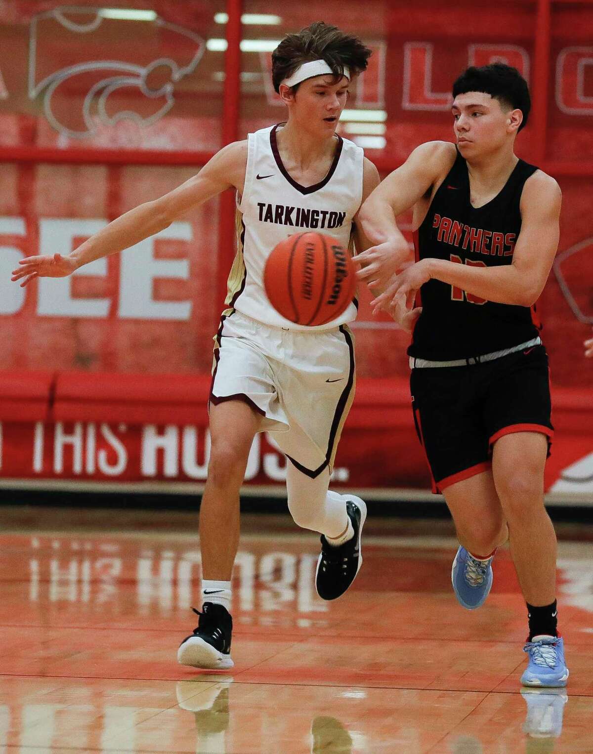 Caney Creek guard Tony Gonzales (13) makes a pass during a high school basketball game at Splendora High School, Thursday, Dec. 9, 2021, in Splendora.