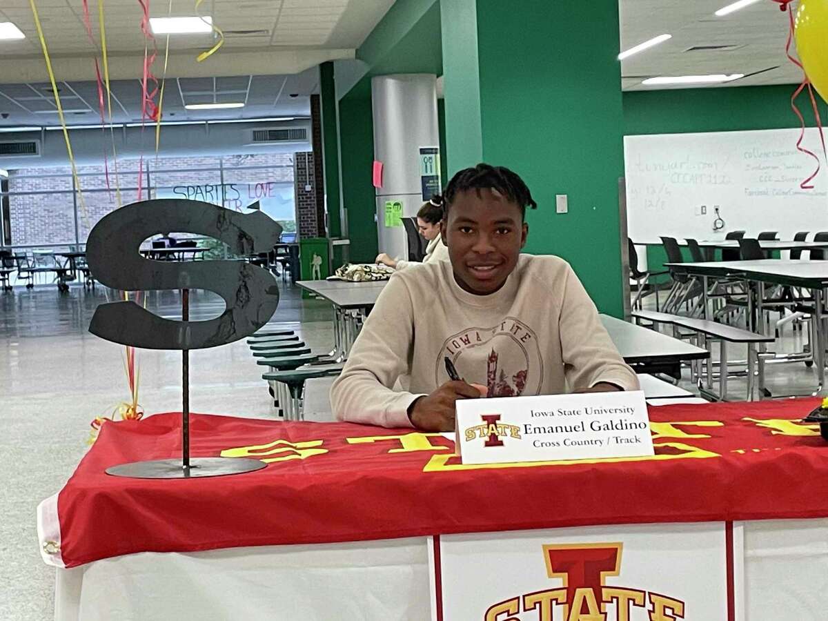 Stratford's Emanuel Galdino celebrated signing his National Letter of Intent to run cross country and track and field at Iowa State University during a ceremony at the school on the afternoon of Dec. 7.