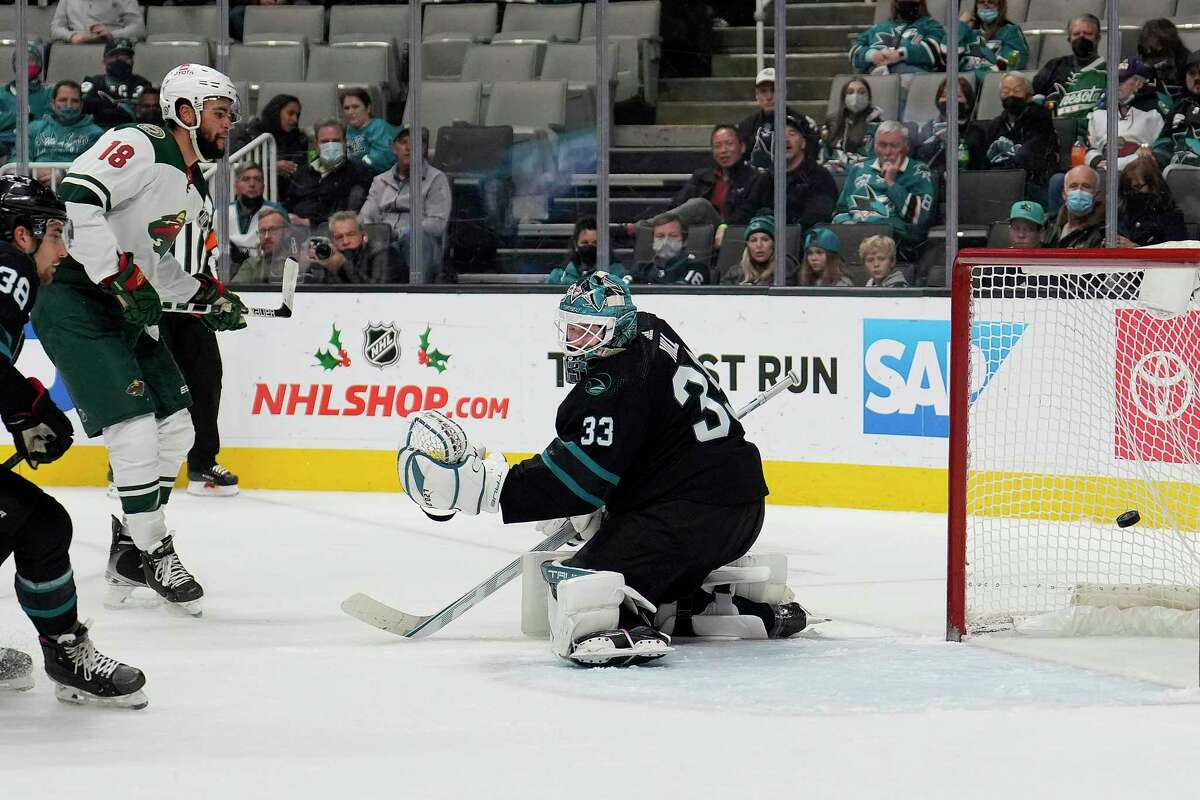 Minnesota Wild left wing Jordan Greenway puts the puck past San Jose Sharks goaltender Adin Hill during the second period of Thursday night’s game at SAP Center.