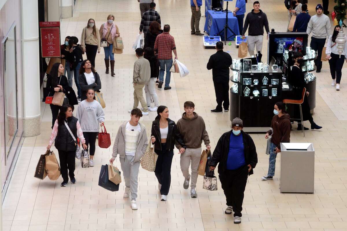 Shoppers stroll Danbury Fair Mall in November 2021, in Danbury, Conn. Across consumer and business-to-business transactions, Connecticut sales tax collections in fiscal 2021 shattered those in previous fiscal years that end in June.