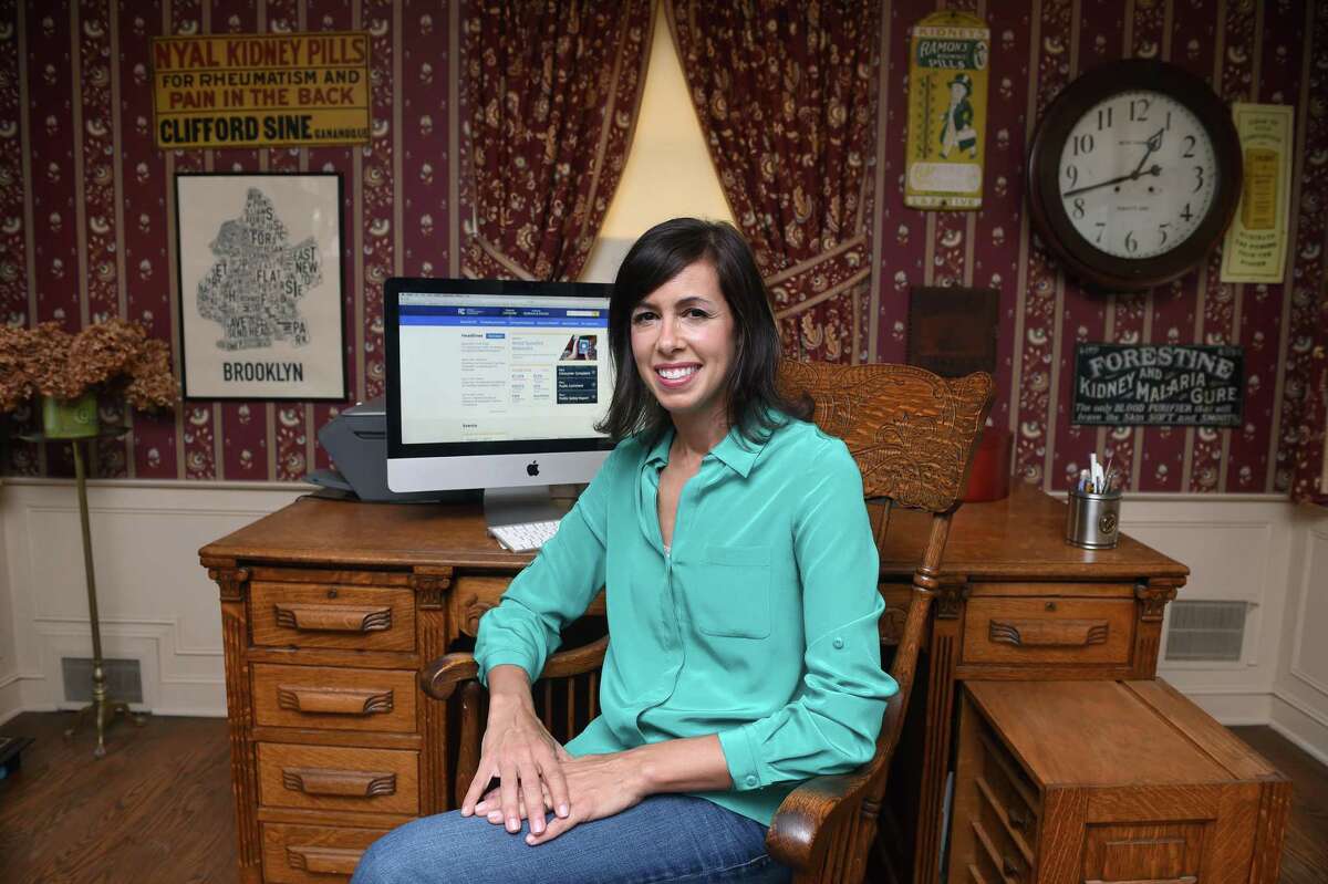 Jessica Rosenworcel, seen here in 2019 in her father's office of her childhood home in West Hartford, was confirmed to a second term as chair of the FCC. It makes Rosenworcel the first permanent female chair of the FCC.