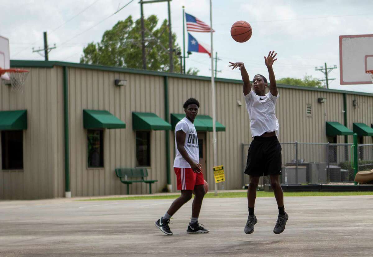 Children play basketball in 2019 during a at the Oscar Johnson, Jr. Community Center. After several meetings of discussion regarding concerns over the funding of a new $35 million Oscar Johnson Community Center and the impact of the city’s nearby wastewater treatment plant, members of the Conroe Industrial Development Corp. and the Conroe City Council agreed during a joint meeting to move forward with the project.