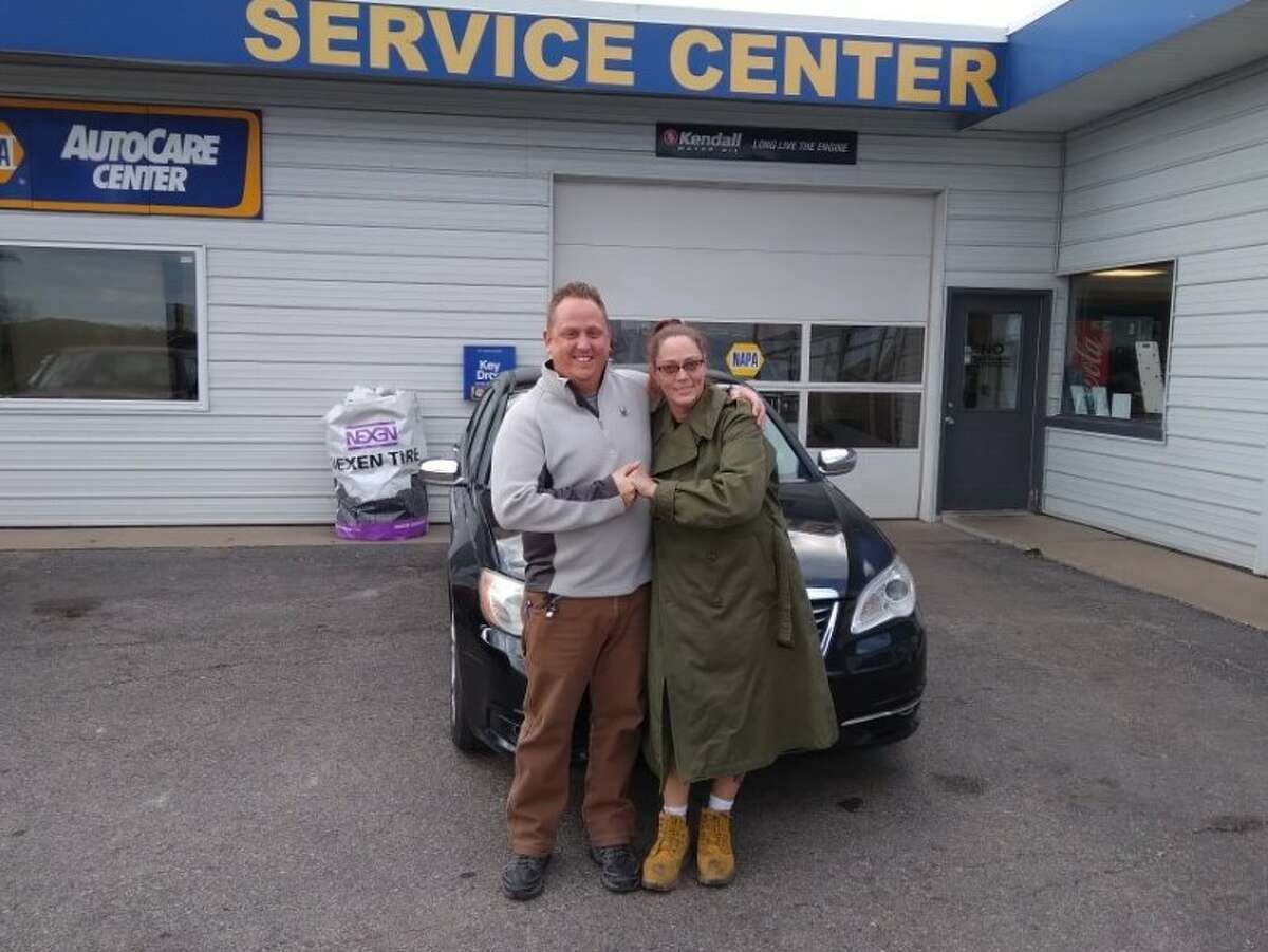 Warriors and Caregivers United member Russ Nehmer and Paris Auto Sales in Big Rapids presented veteran Tammy Blossey with the keys to a Chrysler 200 just before Veterans' Day in November.