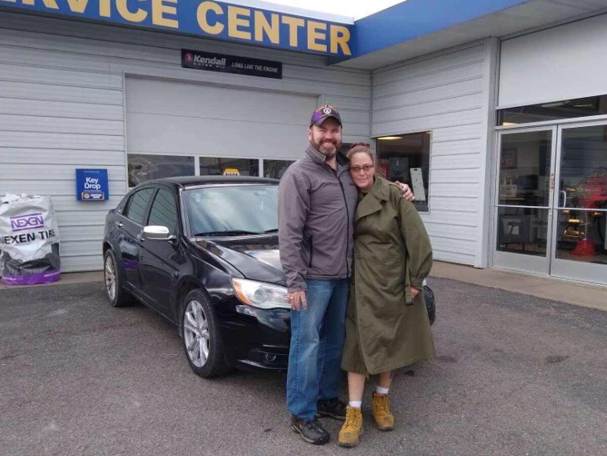 Warriors and Caregivers United member Russ Nehmer and Paris Auto Sales in Big Rapids presented veteran Tammy Blossey with the keys to a Chrysler 200 just before Veterans' Day in November.