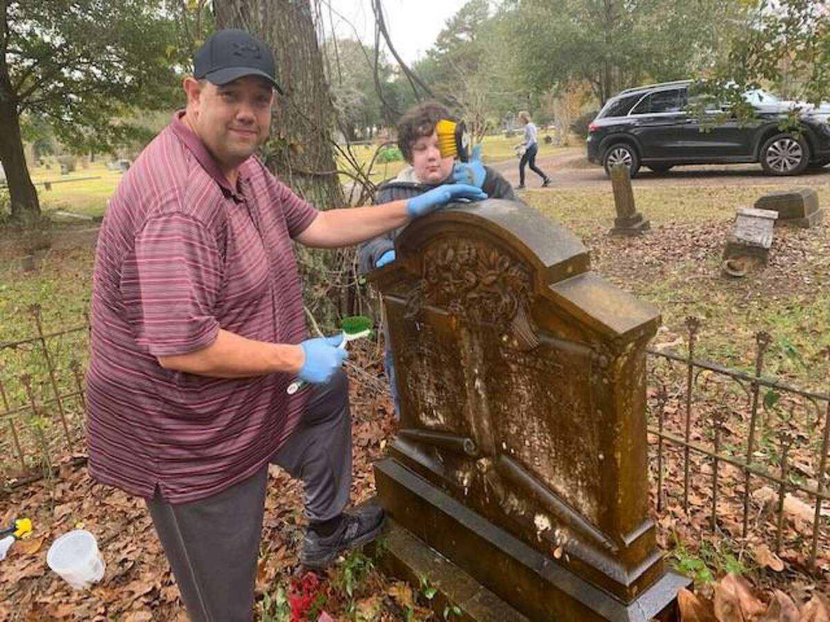Members of the Montgomery County Historical Commission’s Youth Advisory Board (“YAB”) and members of their families helped clean historic tombstones Dec. 4 in the Oakwood Cemetery in Conroe. Bryan Seitz and son, Caden, cleaned the Williams tombstone.