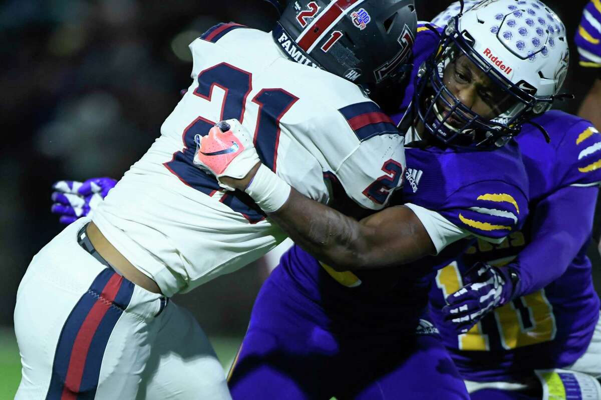 Jersey Village’s Darius Johnson (6) tackles Tompkins’ Caleb Blocker (21) during the first half of a 6A Division I area playoff game Friday, Nov. 19, 2021, in Houston.