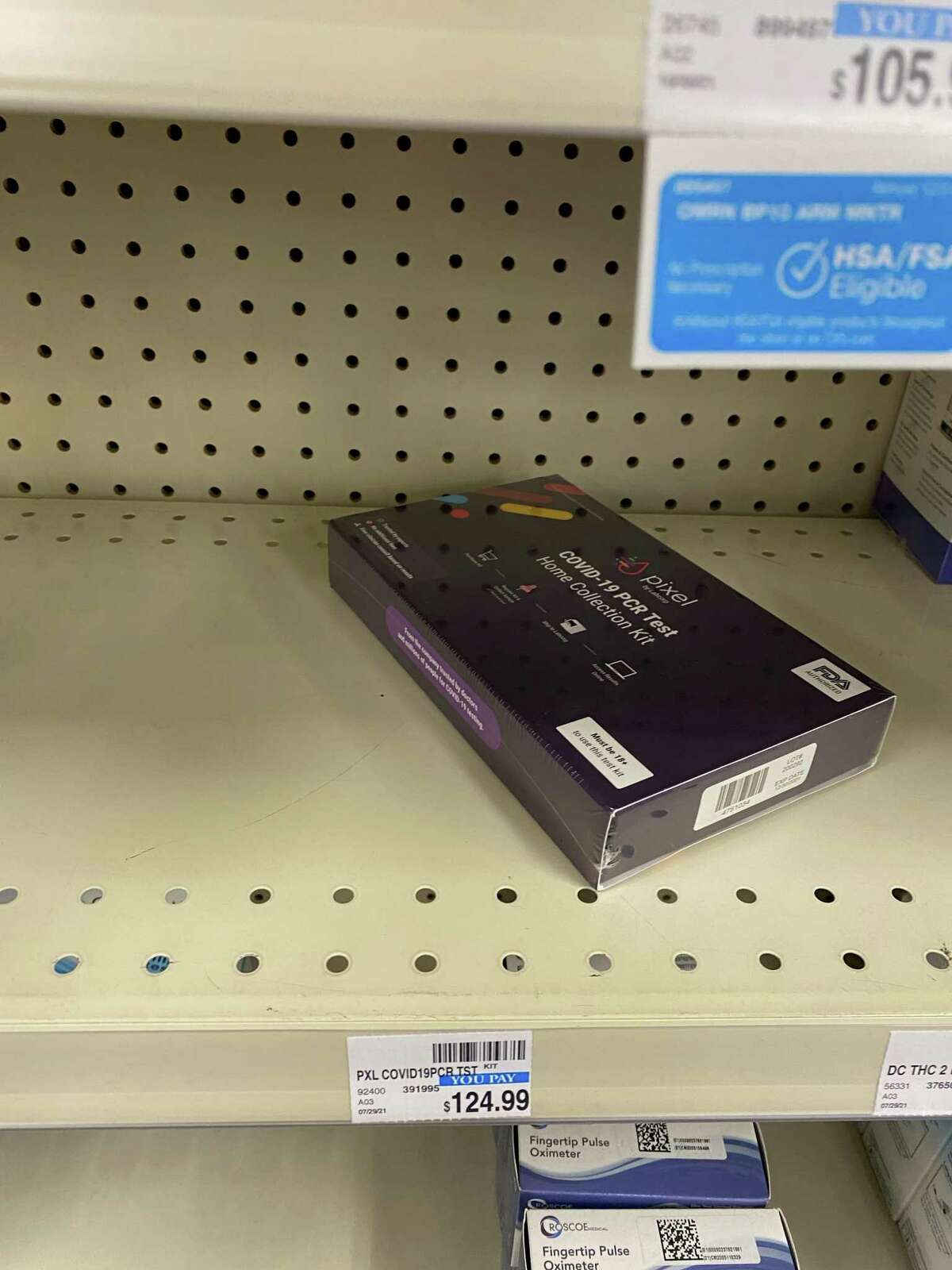A shelf at a Houston-area CVS shows a limited number of COVID home tests on Dec. 8, 2021.
