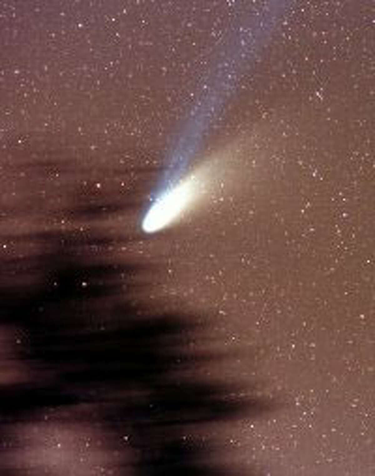 FILE - This image of comet Hale-Bopp was taken on March 8, 1997, at Ft. Jackson, SC.