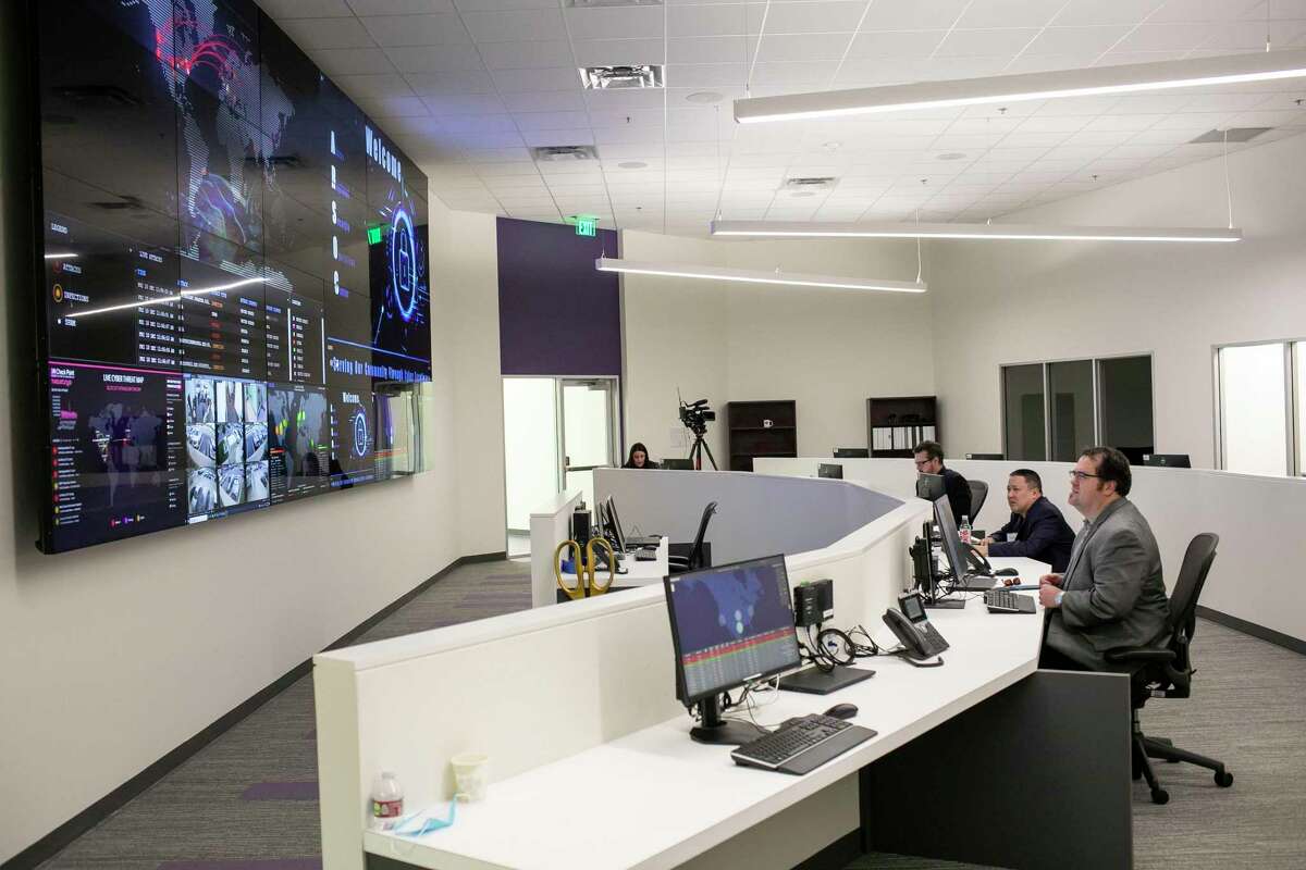 Team members work in the Alamo Regional Security Operations Center at Port San Antonio in December.