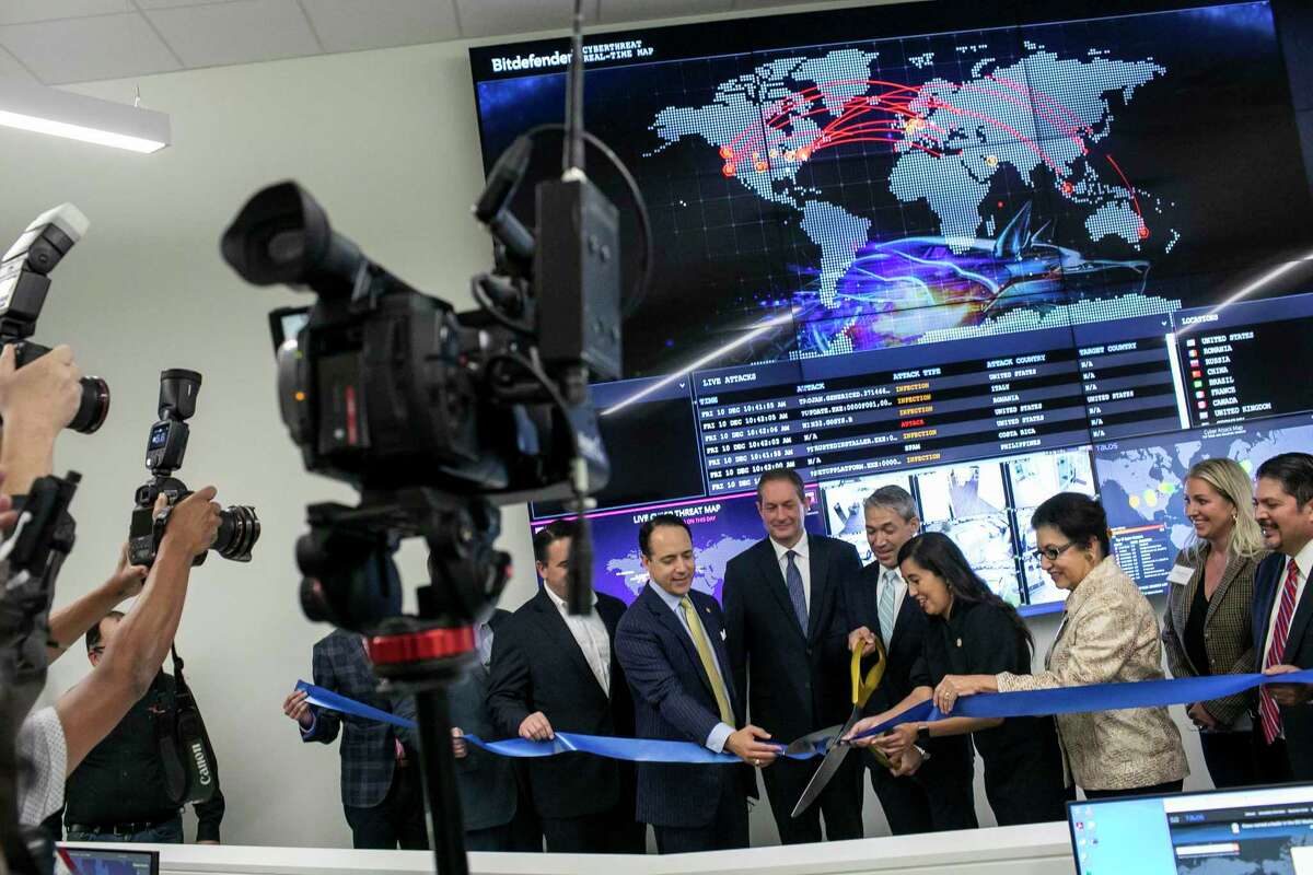 Mayor Ron Nirenburg cuts the ribbon for the newly launched Alamo Regional Security Operations Center at Port San Antonio in San Antonio, Texas, on Dec. 10, 2021.