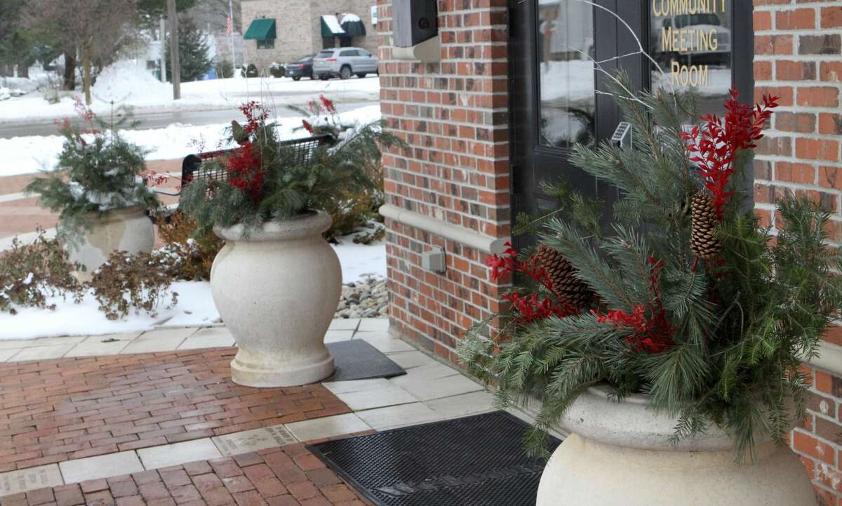 Floods of red and green Christmas decorations can be seen throughout downtown Reed City early Friday afternoon.