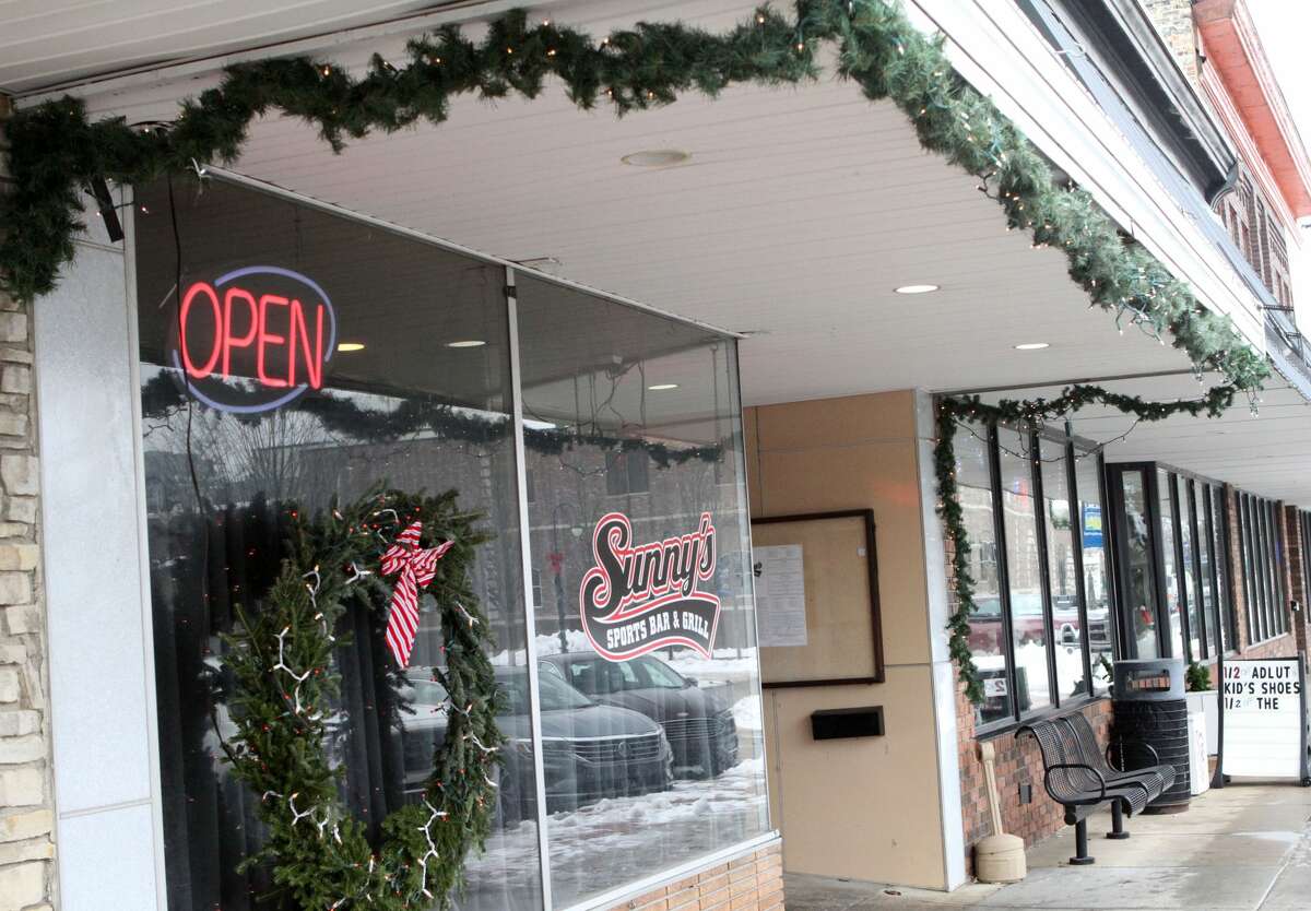 Floods of red and green Christmas decorations can be seen throughout downtown Reed City early Friday afternoon.