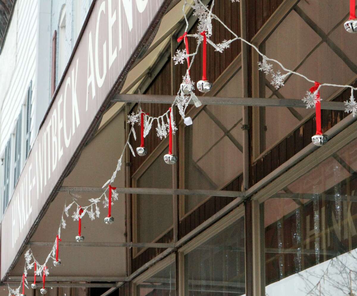 Floods of red and green Christmas decorations can be seen throughout downtown Reed City early Friday afternoon.