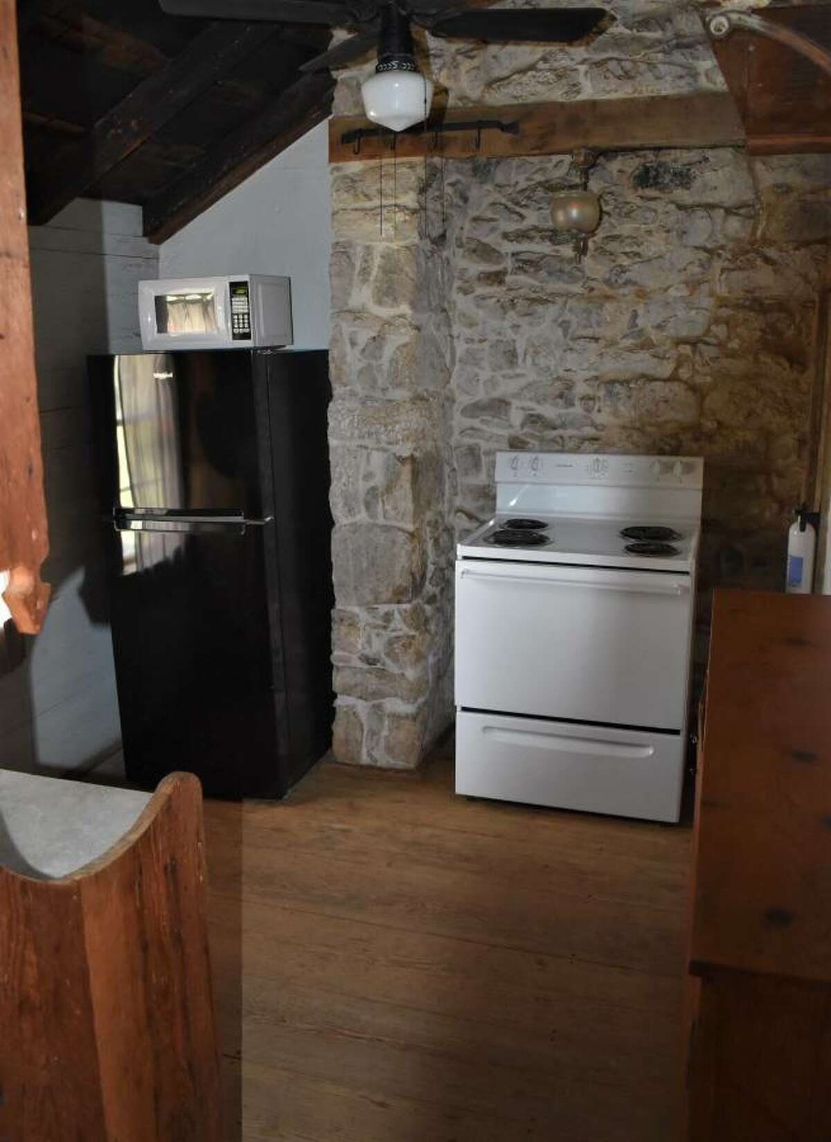 The kitchen appliances are simple, but the exposed limestone is charming.