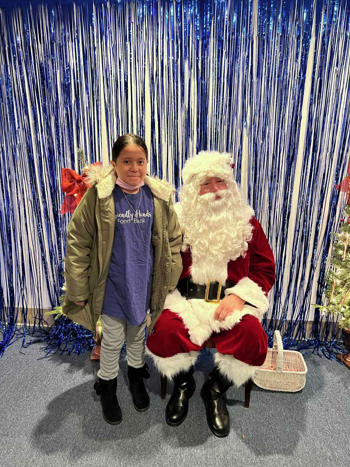 Santa Claus visited Friendly Hands Food Bank Dec. 5, giving visiting children a chance to share their Christmas wishes with him.