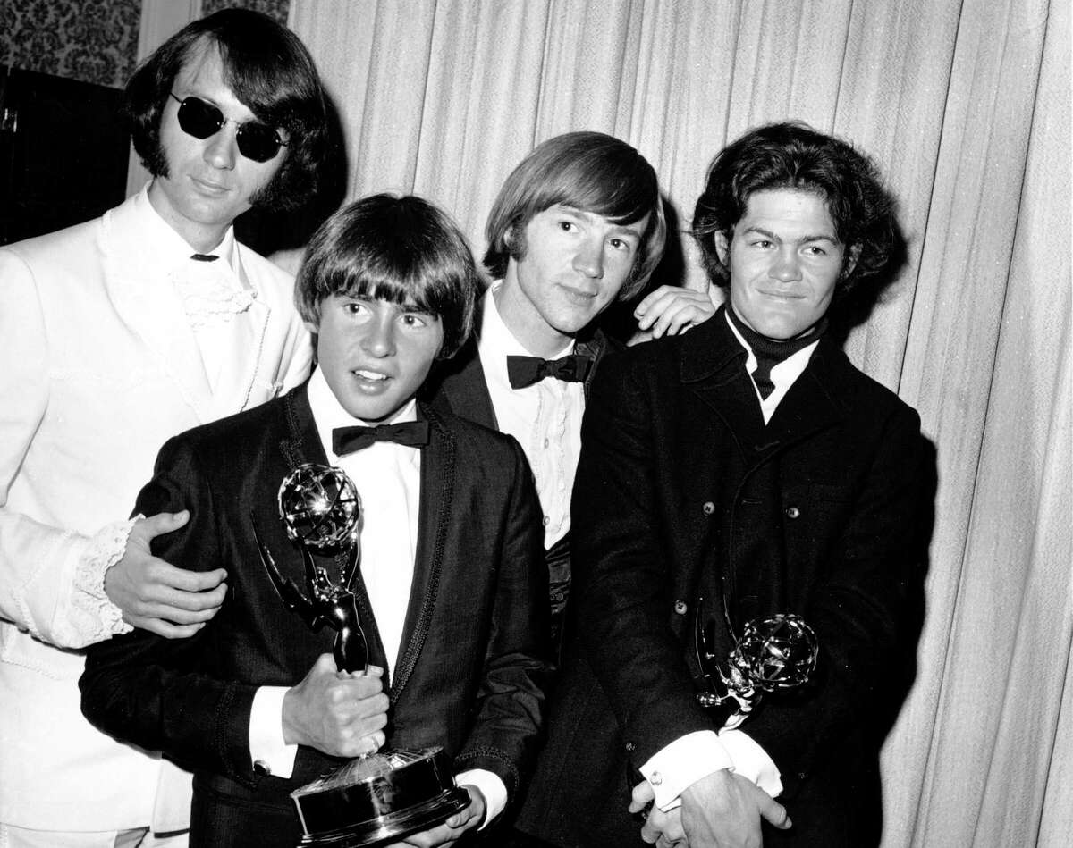 FILE - This June 4, 1967 file photo shows, from left, Mike Nesmith, Davy Jones, Peter Tork, and Micky Dolenz of The Monkees posing with their Emmy award for best comedy series at the 19th Annual Primetime Emmy Awards in Los Angeles. Nesmith, the guitar-strumming member of the 1960s, made-for-television rock band The Monkees, died at home Friday of natural causes, his family said in a statement. He was 78. (AP Photo, File)