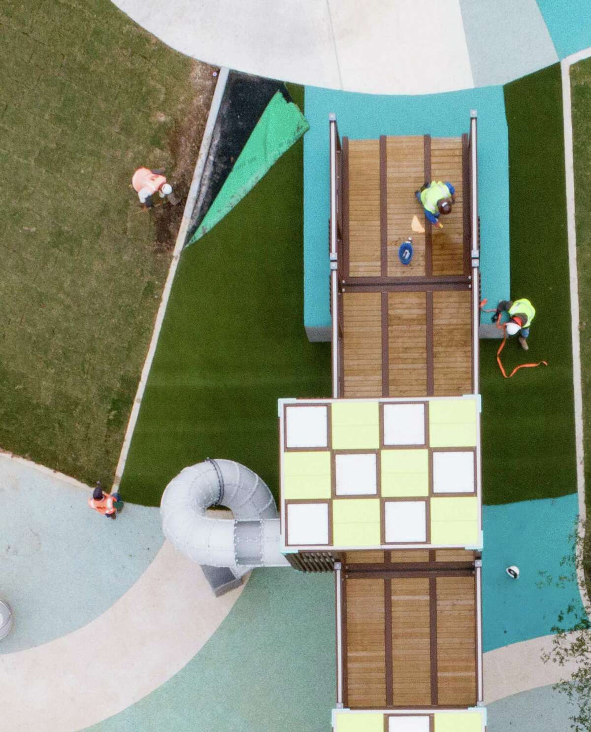 A drone photo of workers putting on the final touches on an all inclusive playground at James Driver Park in Aldine on Tuesday, Dec. 7, 2021. The park, which features playground equipment appropriate for children with a variety of abilities, officially opens on Saturday.