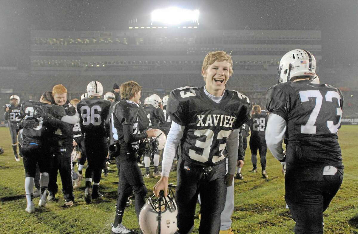 Xavier defeated NFA 48-14 in the 2012 Class LL football state championship at Rentschler Field in East Hartford. Columnist Jeff Jacobs wants to see the CIAC championships return to one site players will remember for the rest of their lives.