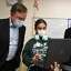 From left; Gov. Ned Lamont chats with Coding Club fourth grader Mel Sacramento, 9, and Principal Sangeeta Bella during a visit to Discovery Magnet School in Bridgeport, Conn. on Friday, December 10, 2021.