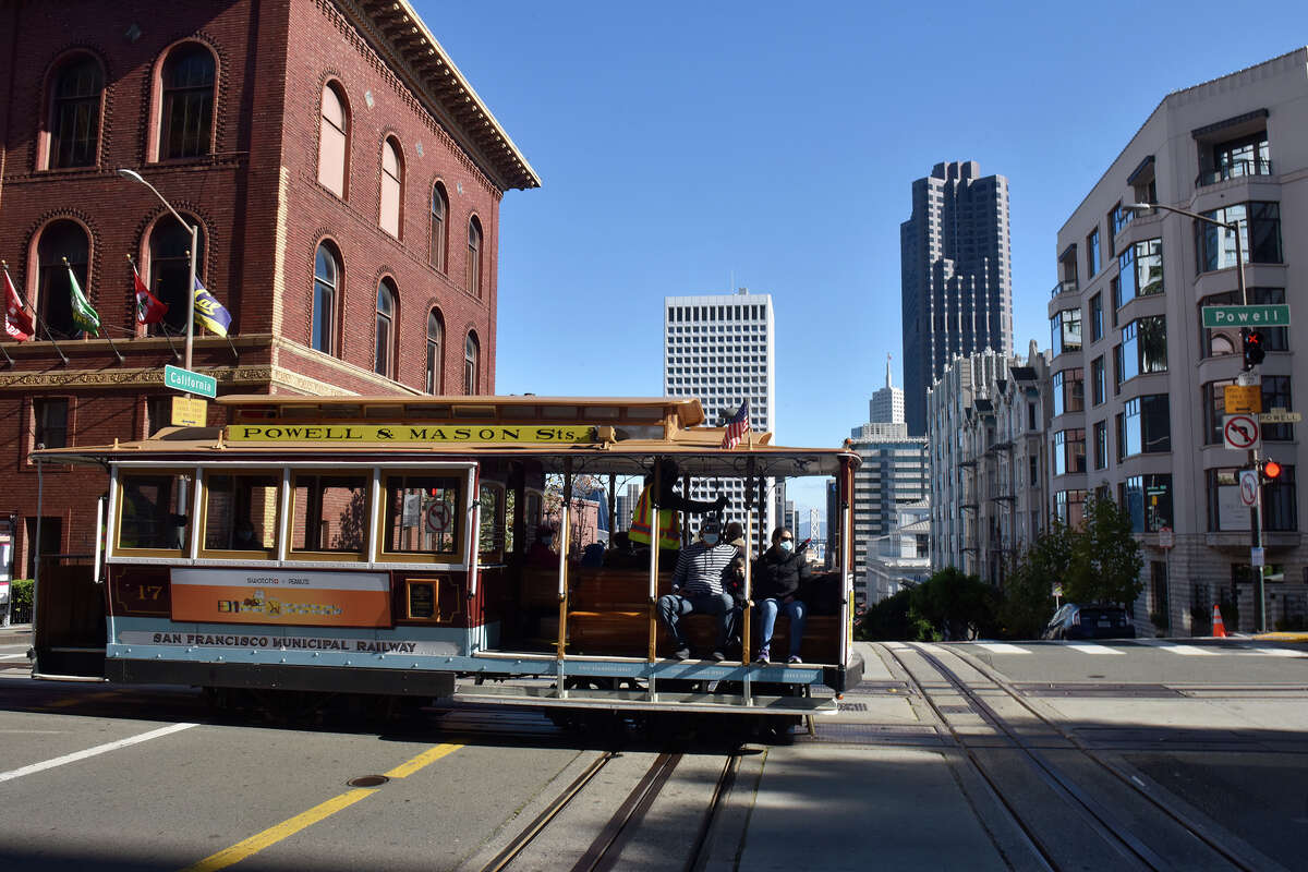 A San Francisco cable car arrives at the top of the hill at the intersection of Powell and California on Thursday, December 9, 2021.