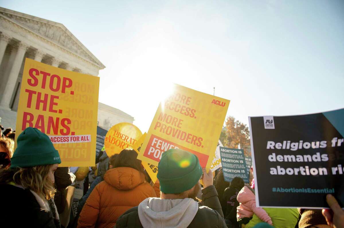 Demonstrators organized by the Center for Reproductive Rights rally as the U.S. Supreme Court hears oral arguments on an abortion case on Dec. 1.